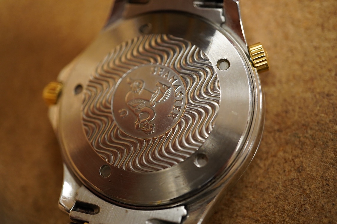 A gentleman's mid 1980's stainless steel and gold plated Omega Seamaster Professional Chronometer automatic wrist watch, with blue dial, dot numerals and date aperture, movement c.1109, case diameter 40mm, on an Omega st